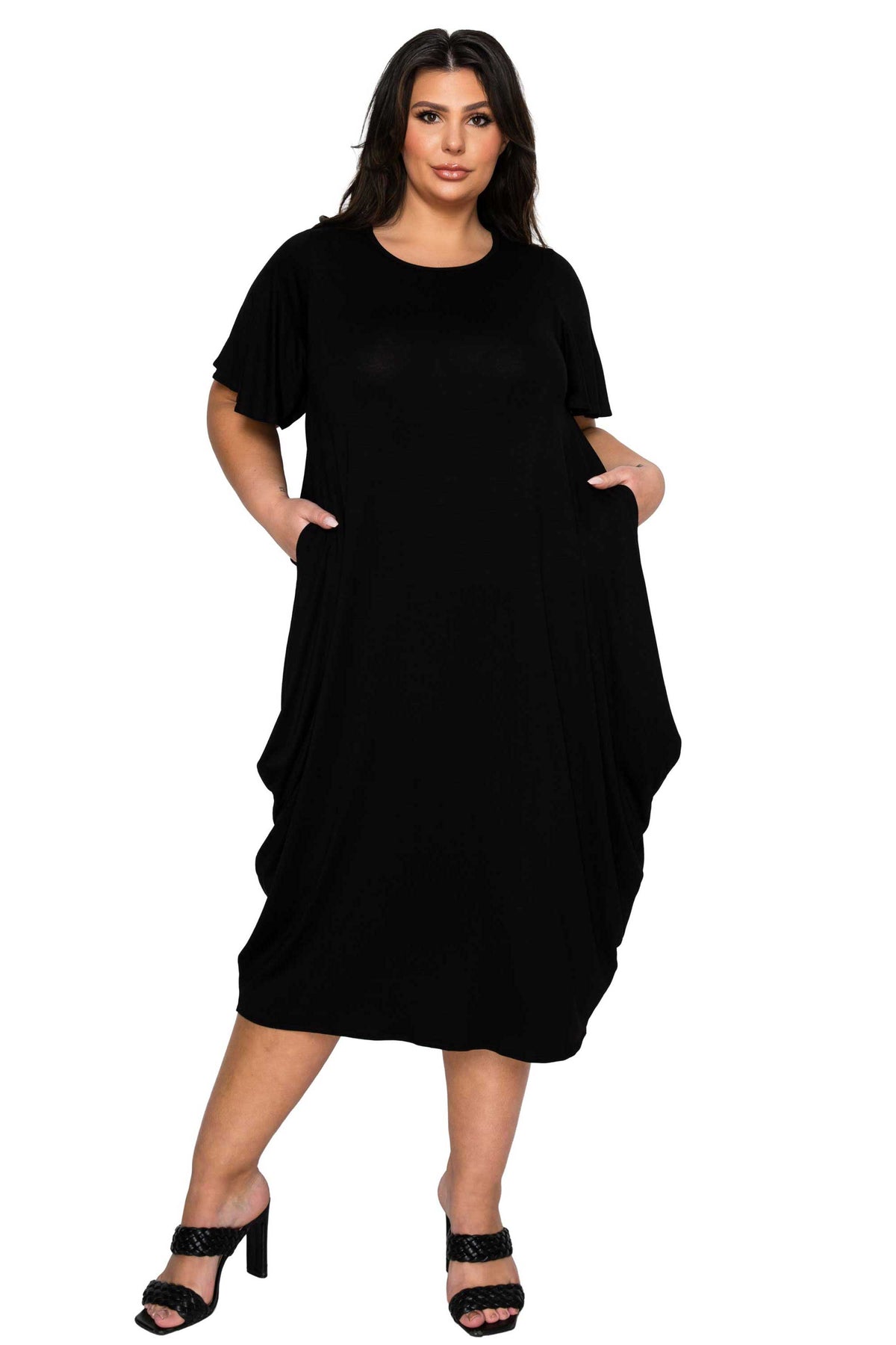 Woman wearing a black dress on a white background