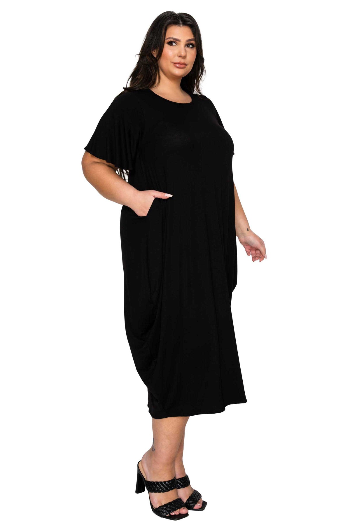 Woman wearing a black dress on a white background