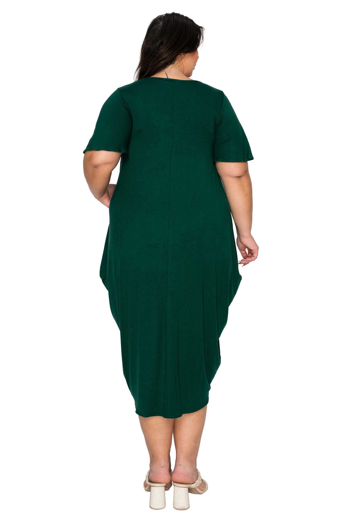 Green dress worn by a person on a white background