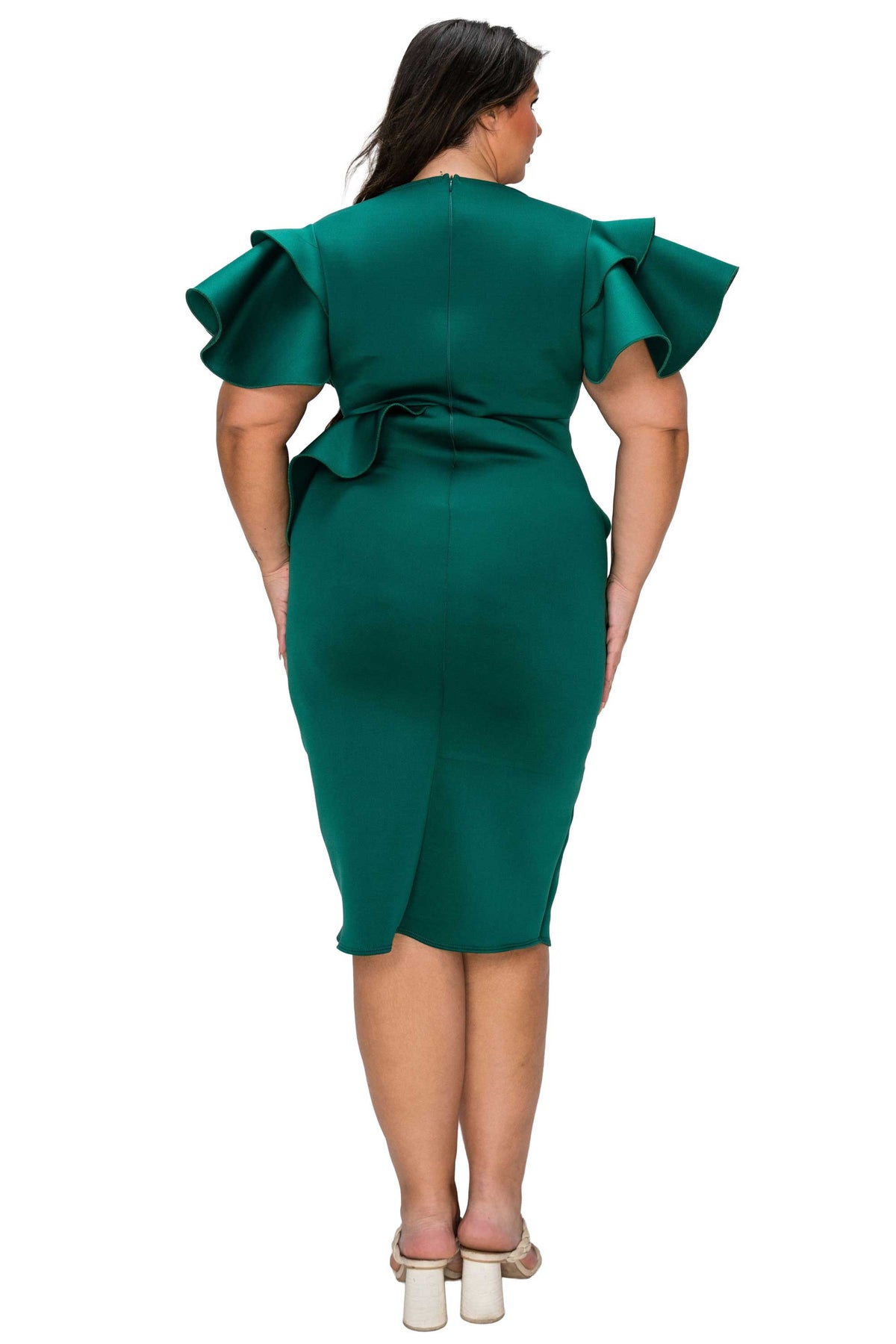 Green dress with ruffled sleeves worn by a model on a white background