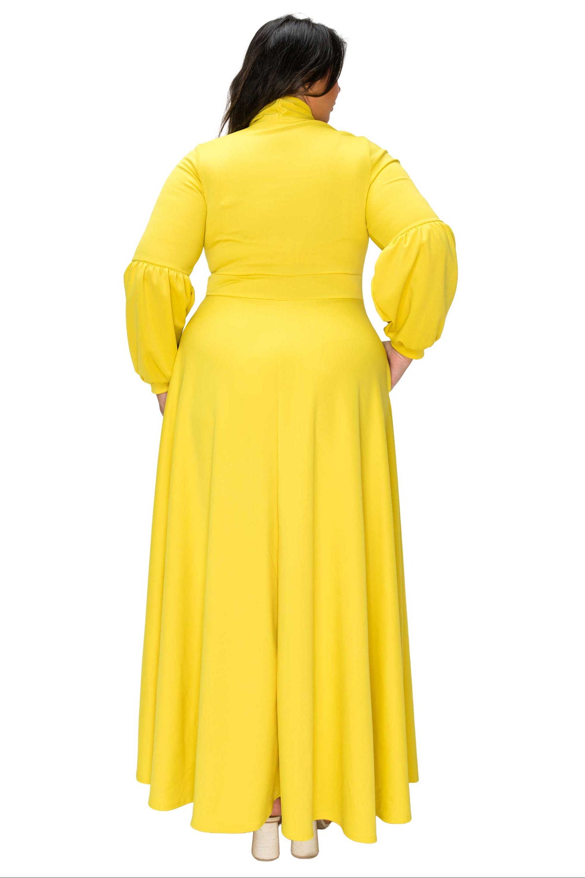 Yellow dress with long sleeves on a white background