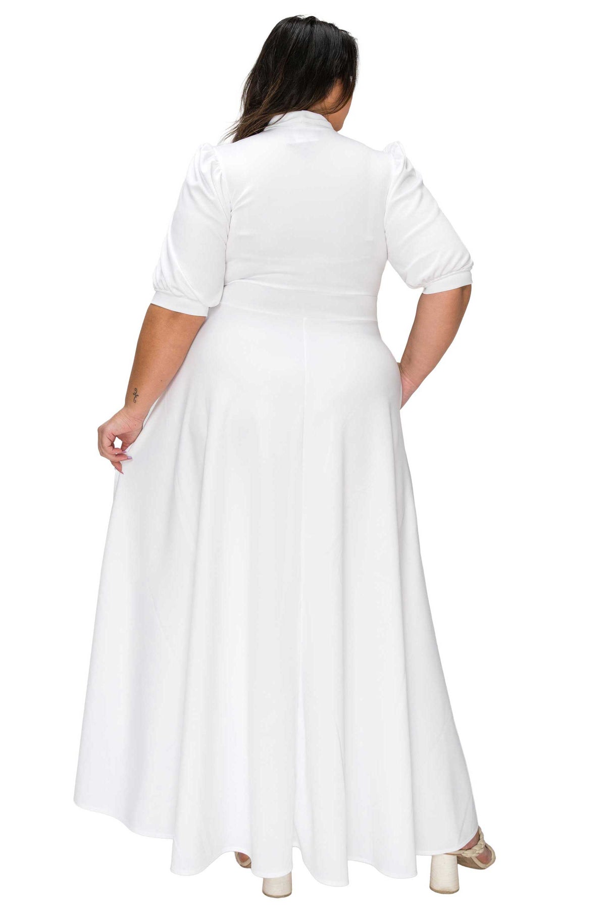 Woman wearing a white dress with a belt on a white background