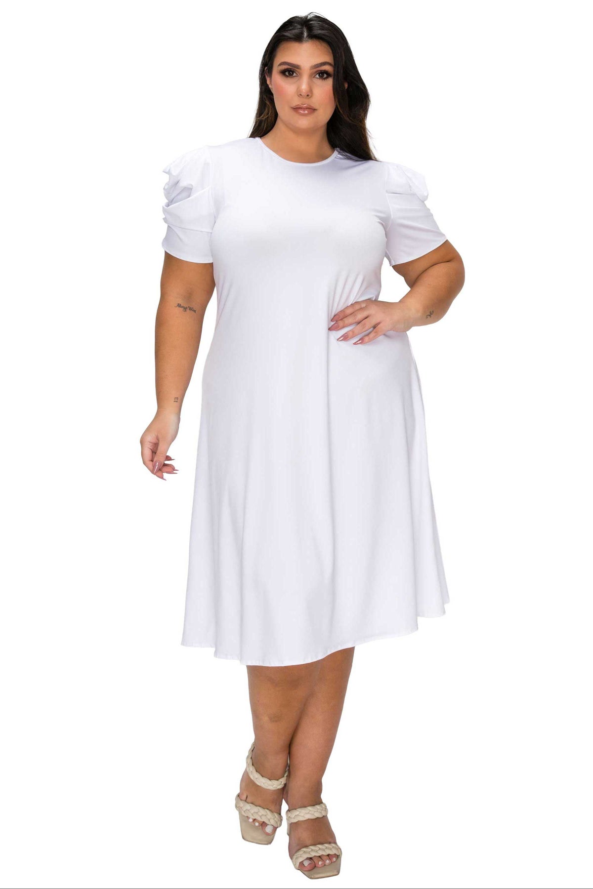 Woman wearing a white dress on a white background