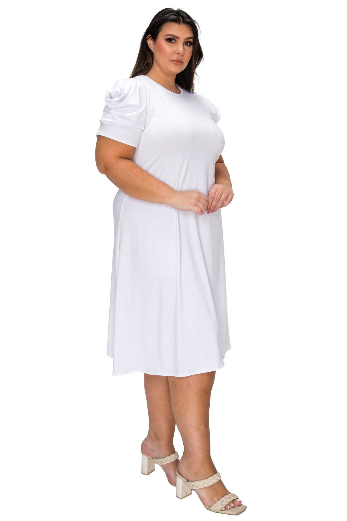 Woman wearing a white dress on a white background