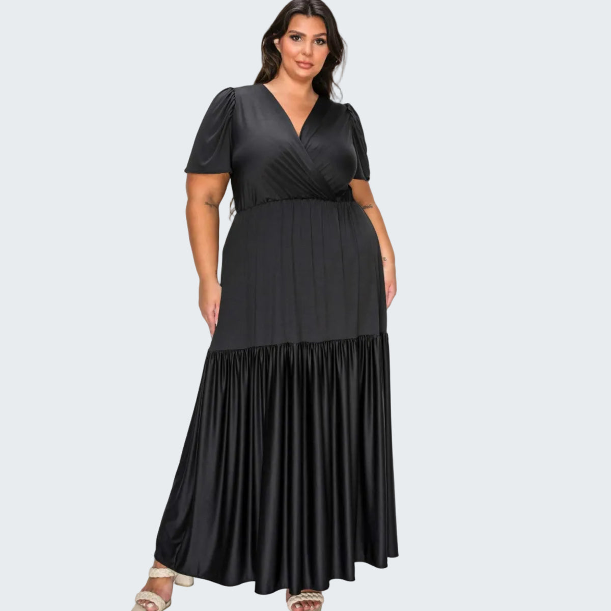 Woman wearing a black dress with a white background