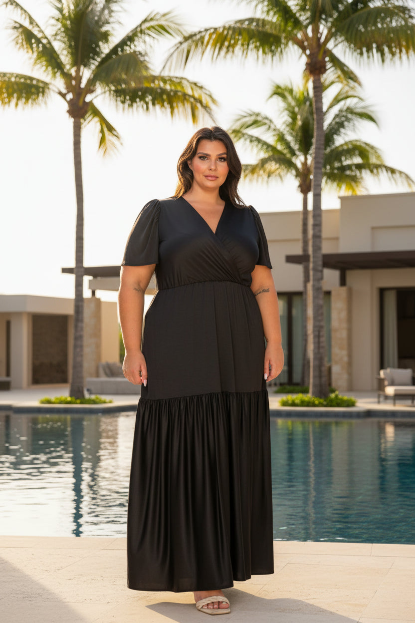 Woman wearing a black dress on a white background