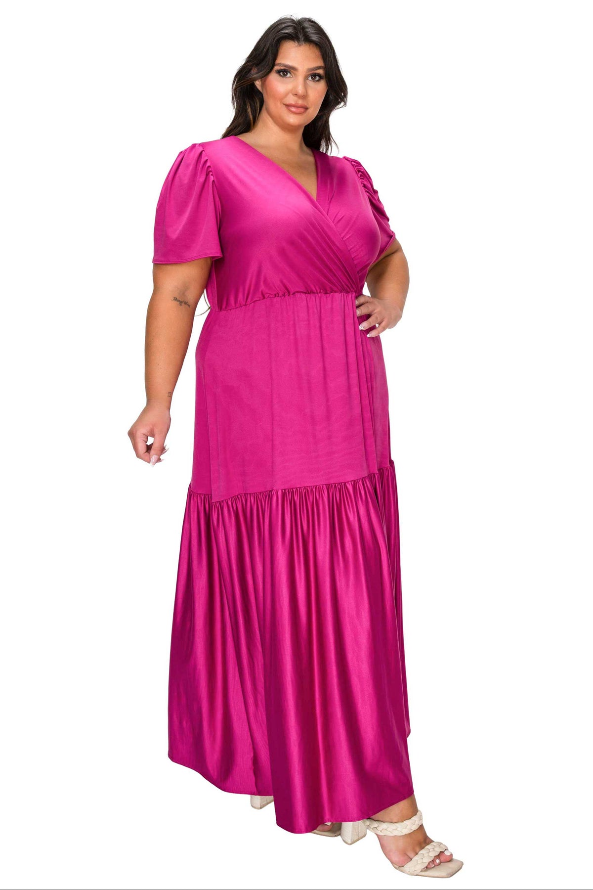 Woman wearing a pink dress on a white background