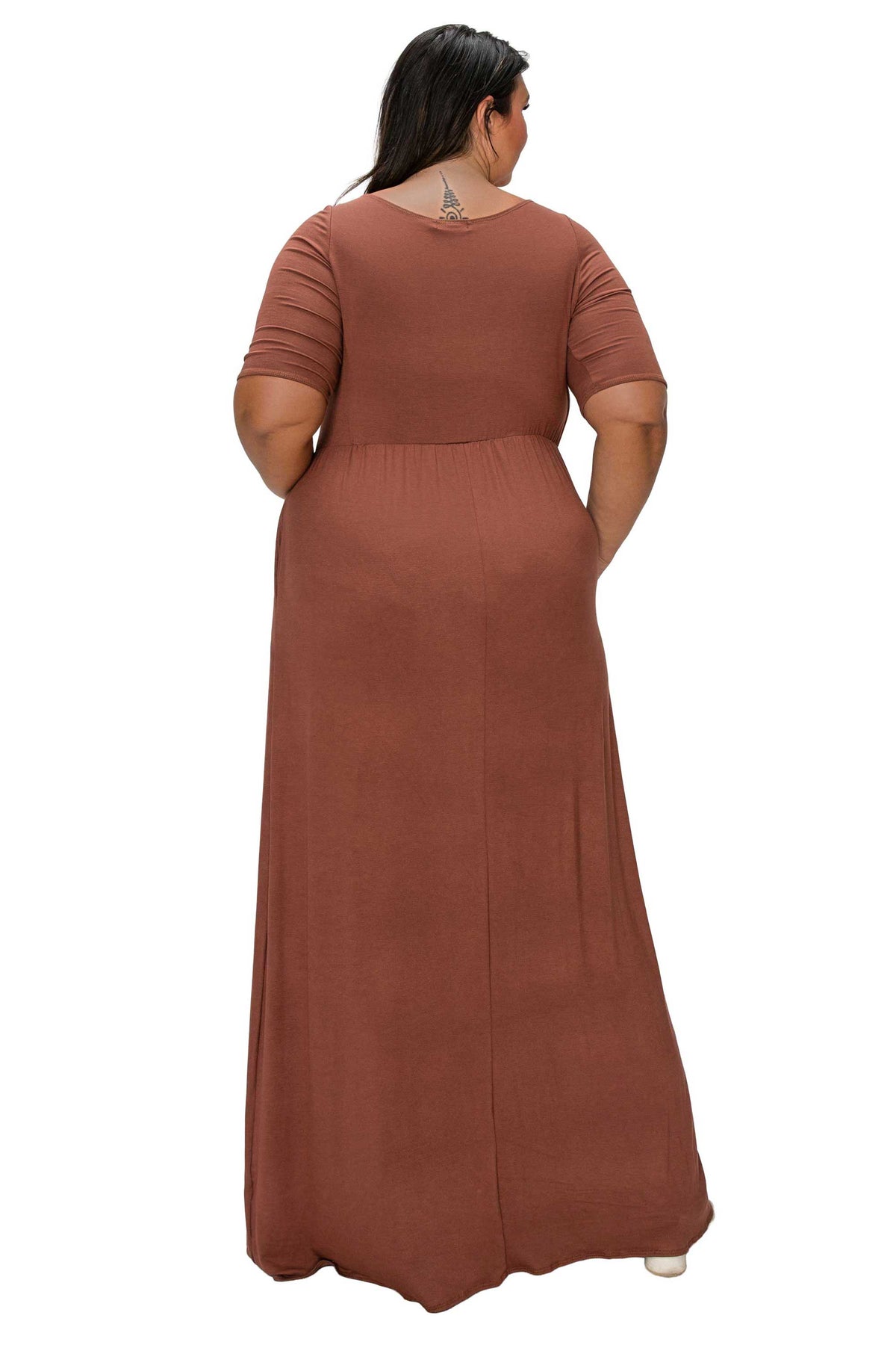 A woman shown from the back wearing a rust-brown short-sleeve maxi dress against a plain white background.