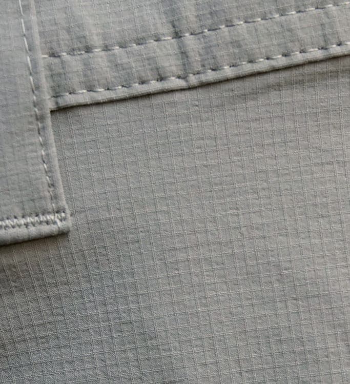 Close-up of gray fabric with stitching detail