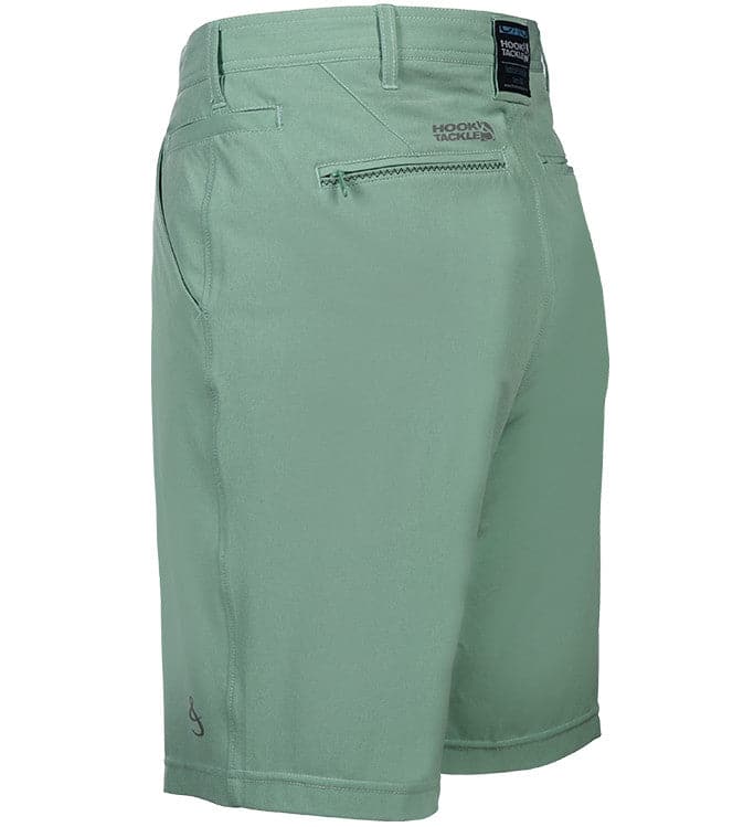 Green shorts with a visible brand label on a white background