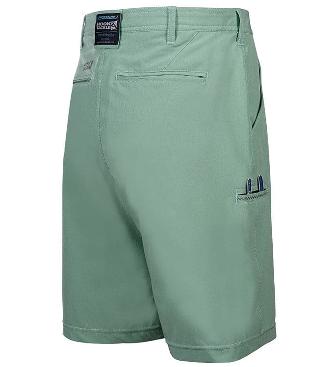 Green shorts with a brand label on a white background