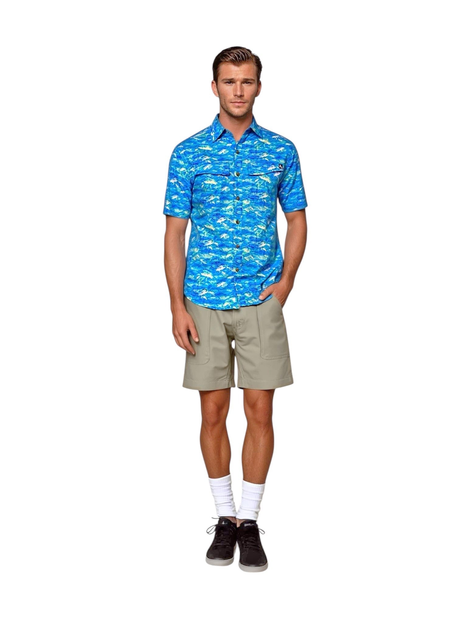 Man wearing a blue patterned shirt and beige shorts on a white background