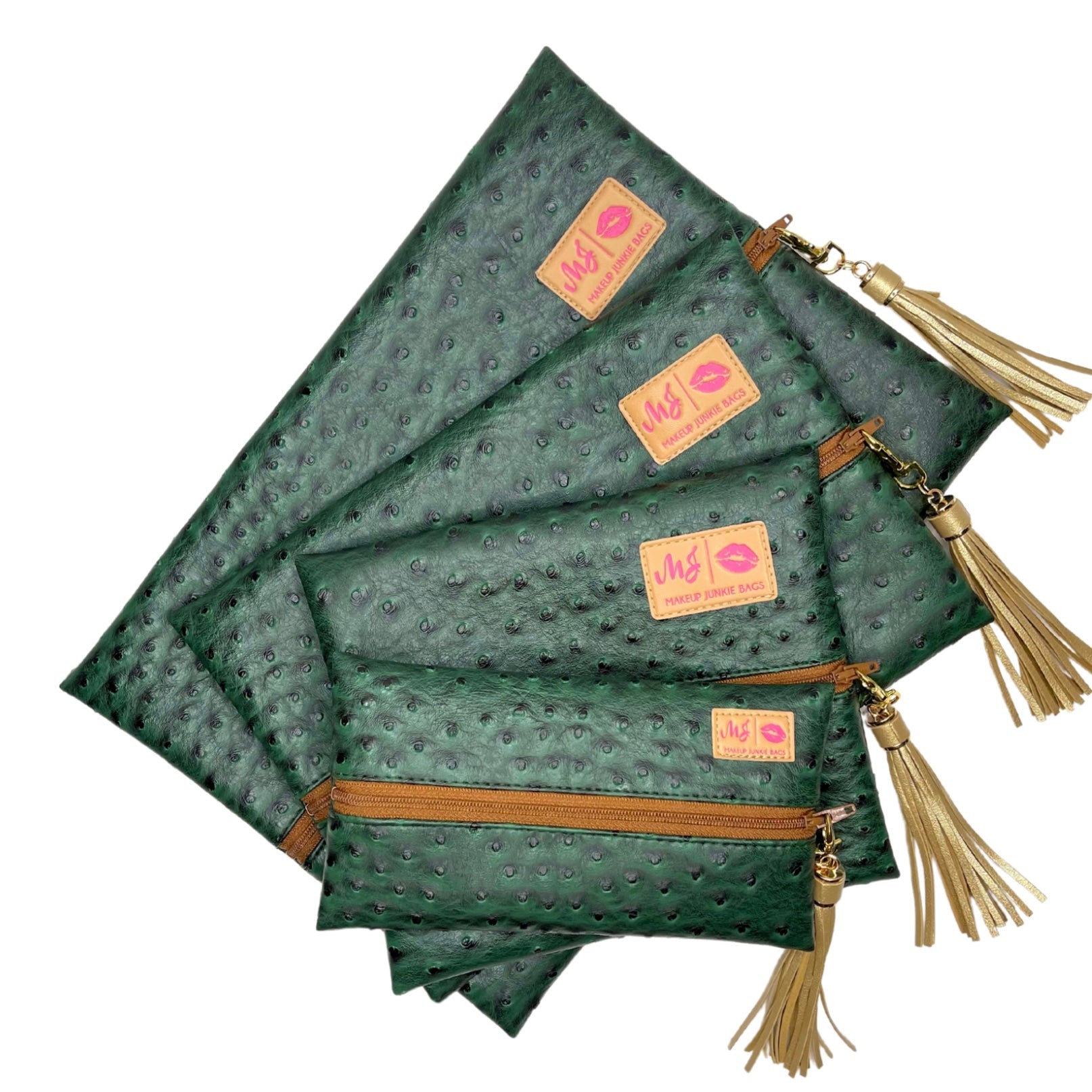 Green textured pouches with gold zippers and tassels on a white background