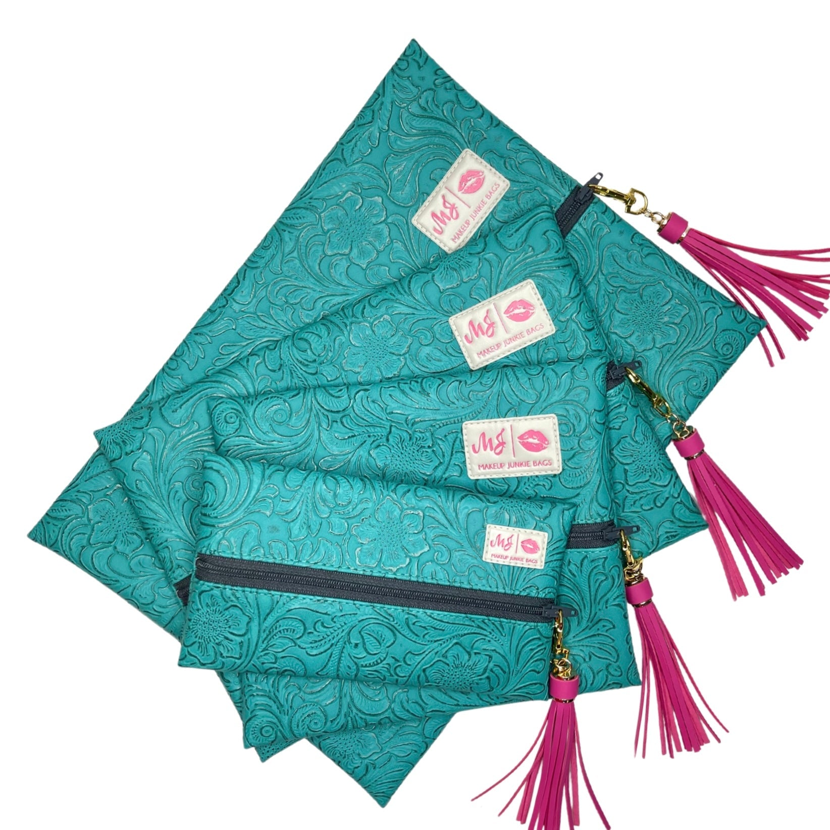 Set of teal patterned pouches with pink tassels and visible brand label on a white background
