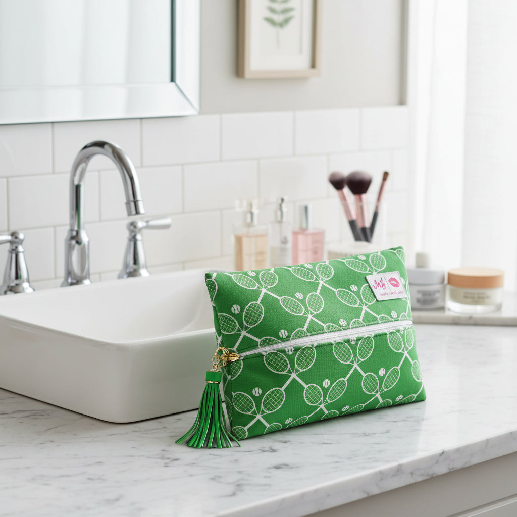 Green pouch with tennis racket and ball pattern on a white background