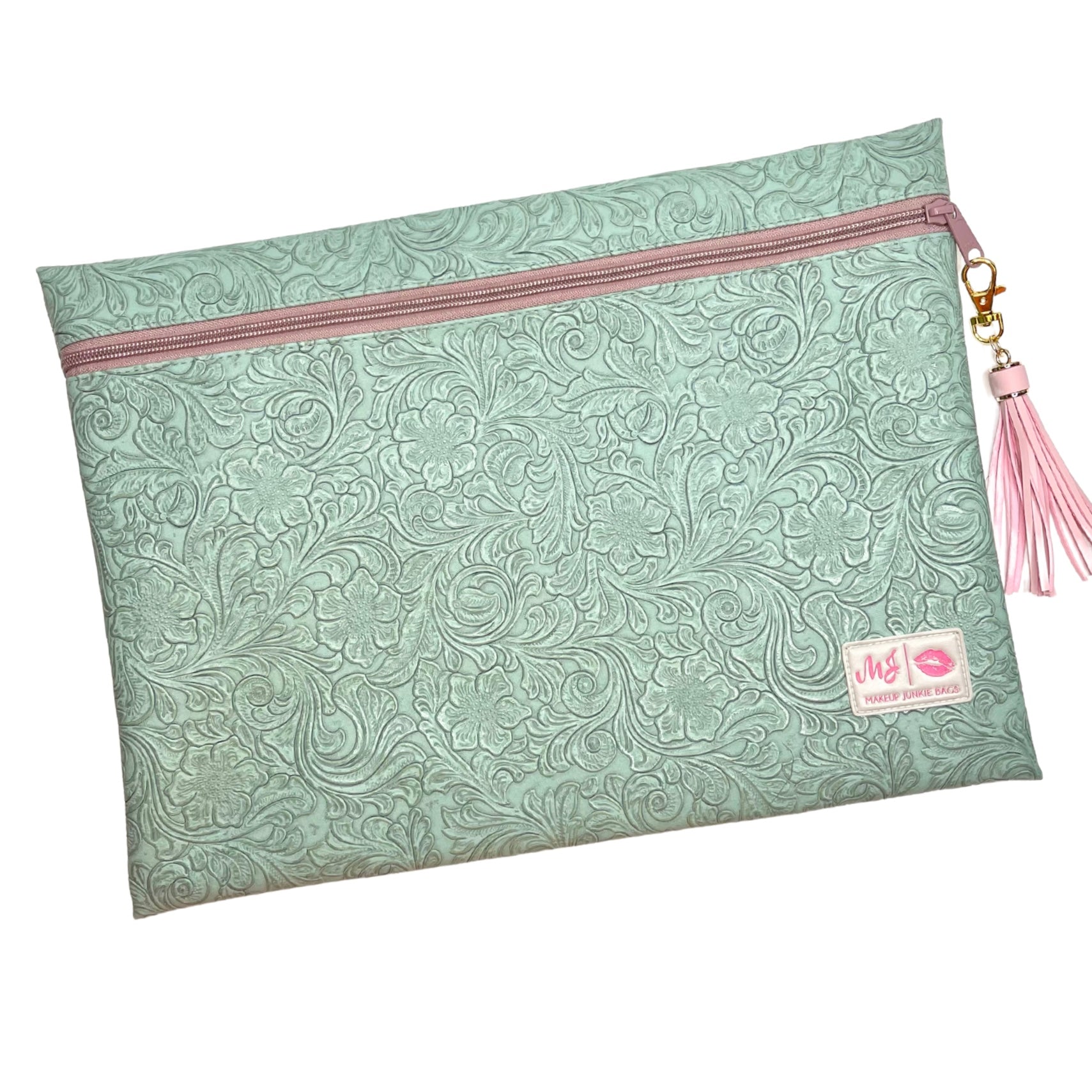 Patterned pouch with pink zipper and tassel on a white background