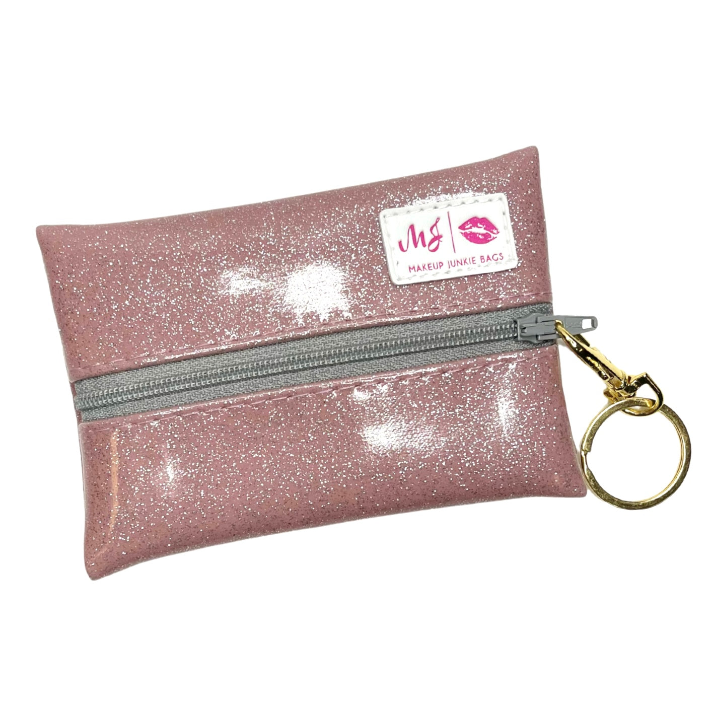 Pink glittery pouch with a keychain and visible brand label on a white background