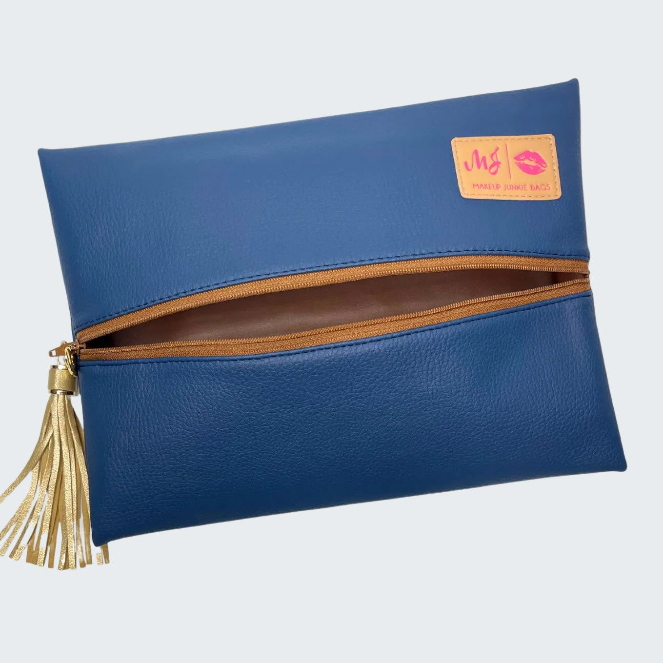Blue clutch bag with gold tassel and visible brand logo on a white background