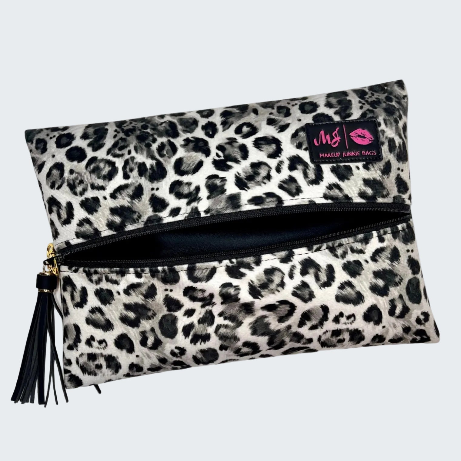 Leopard print makeup bag with a visible brand label on a white background