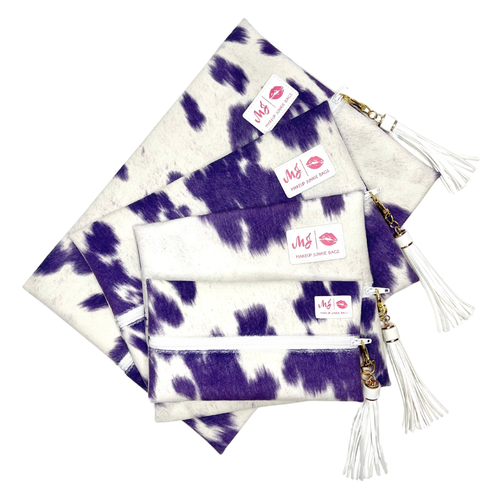 Set of purple and white patterned bags with visible brand labels on a white background