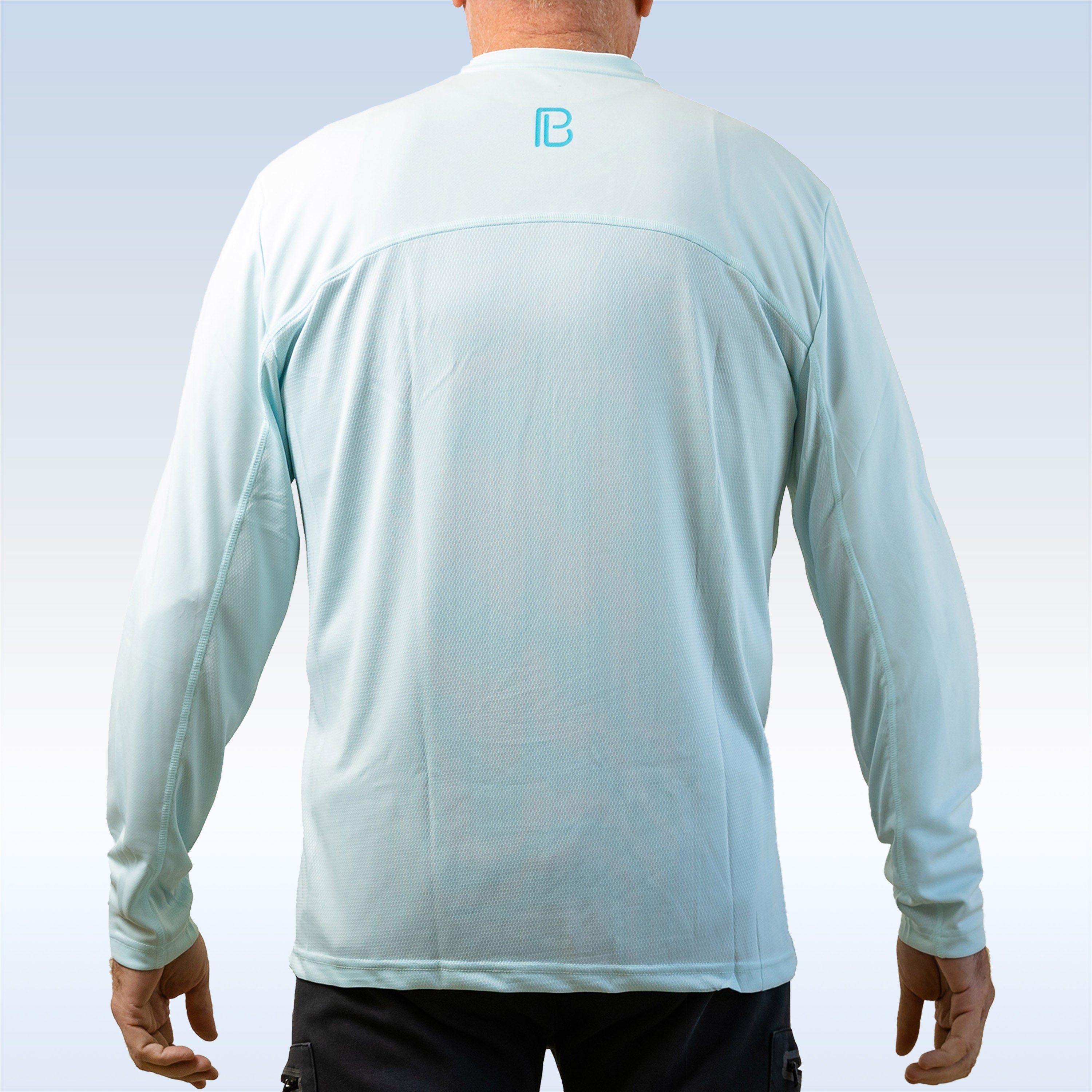Light blue long-sleeve shirt with a logo on the back, worn by a person against a light gray background