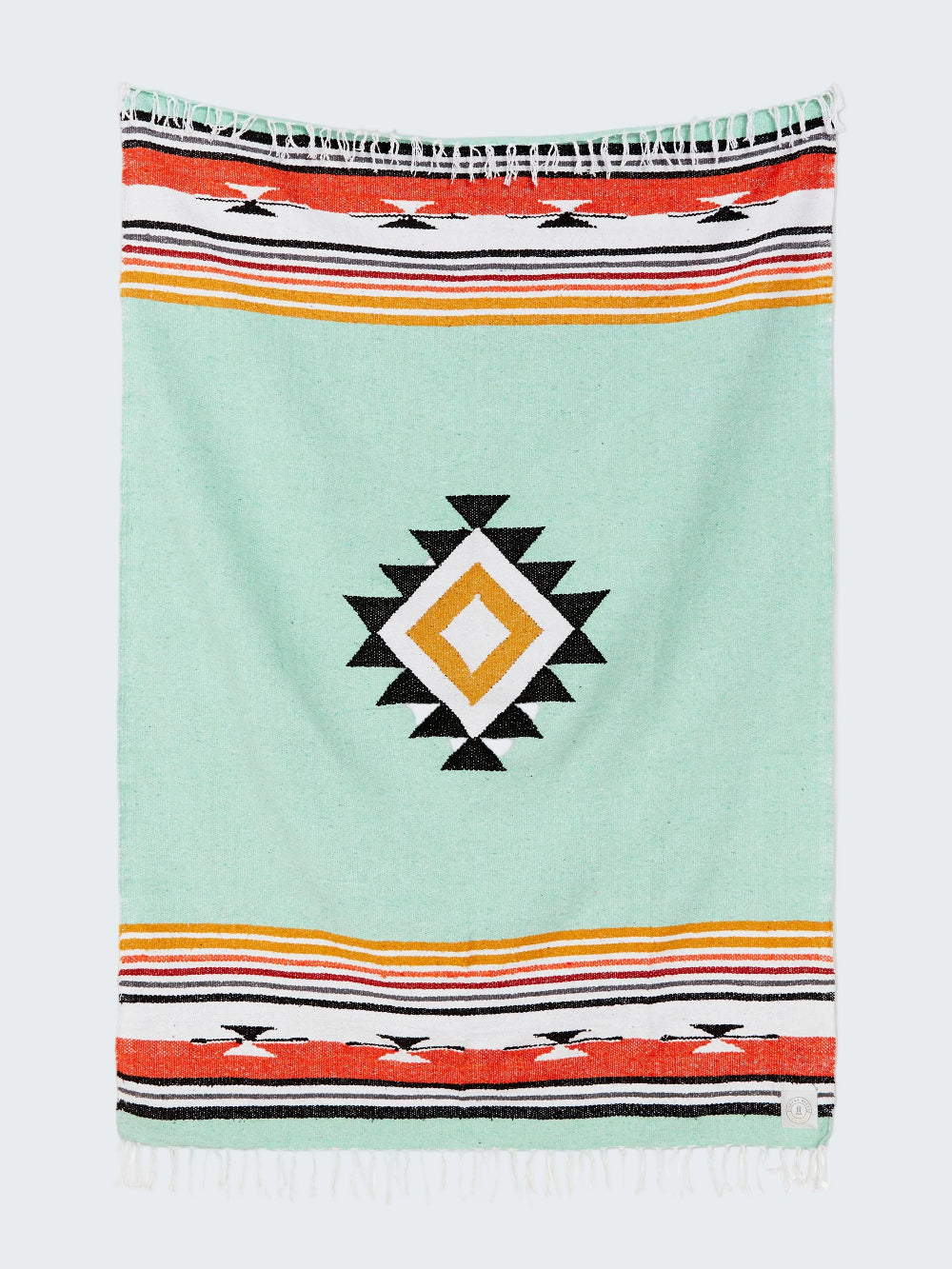 Colorful towel with geometric pattern on a light blue background