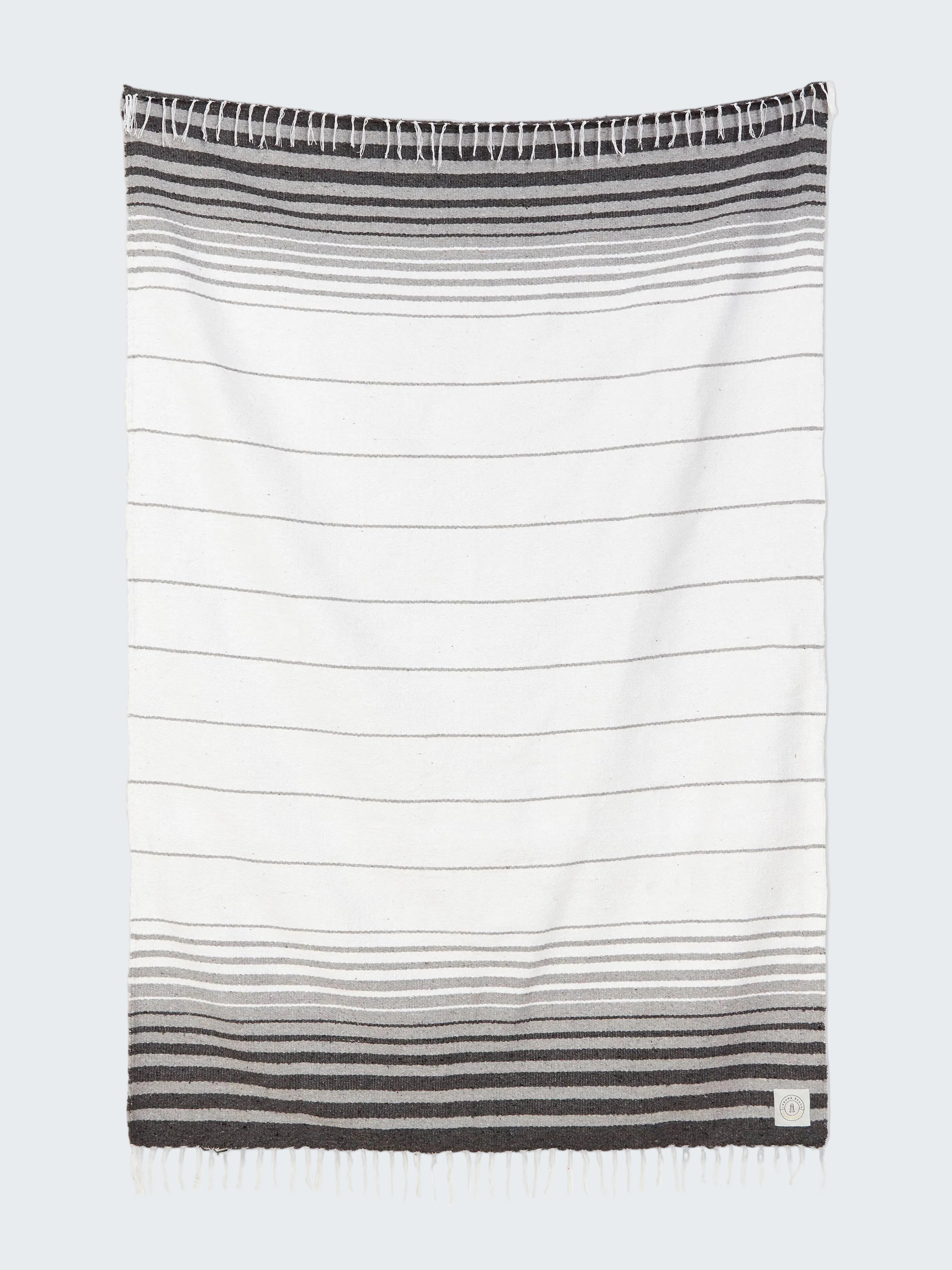 Striped towel with gradient design on a white background