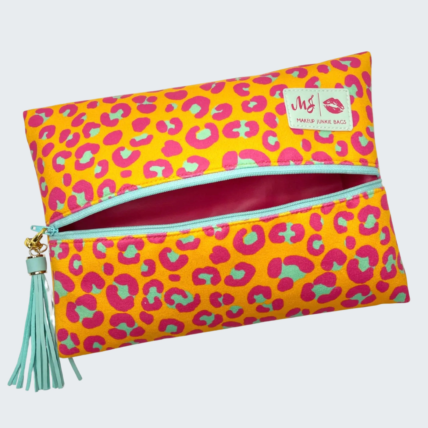Colorful leopard print pouch with a tassel on a white background