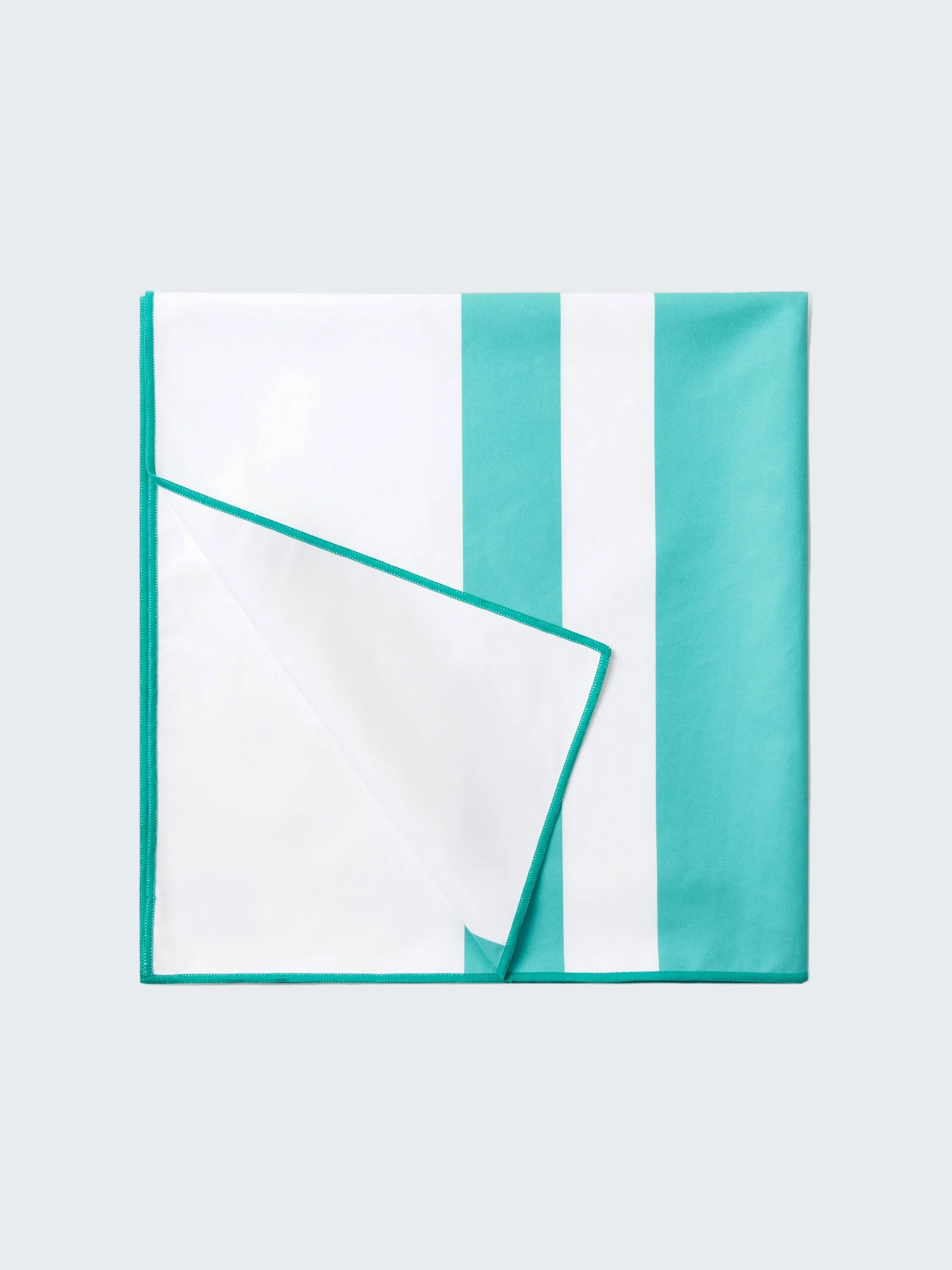 Teal and white striped fabric on a white background