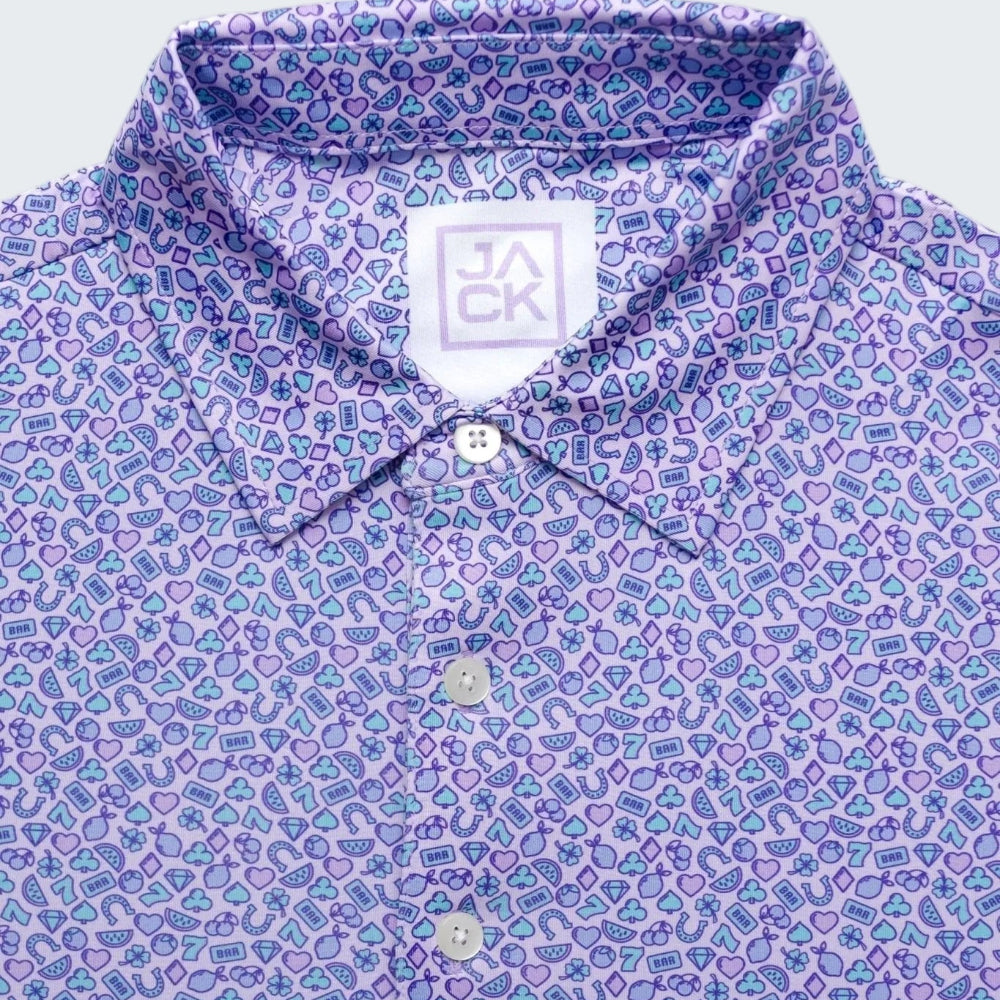 Close-up of a patterned shirt with a brand label on a white background