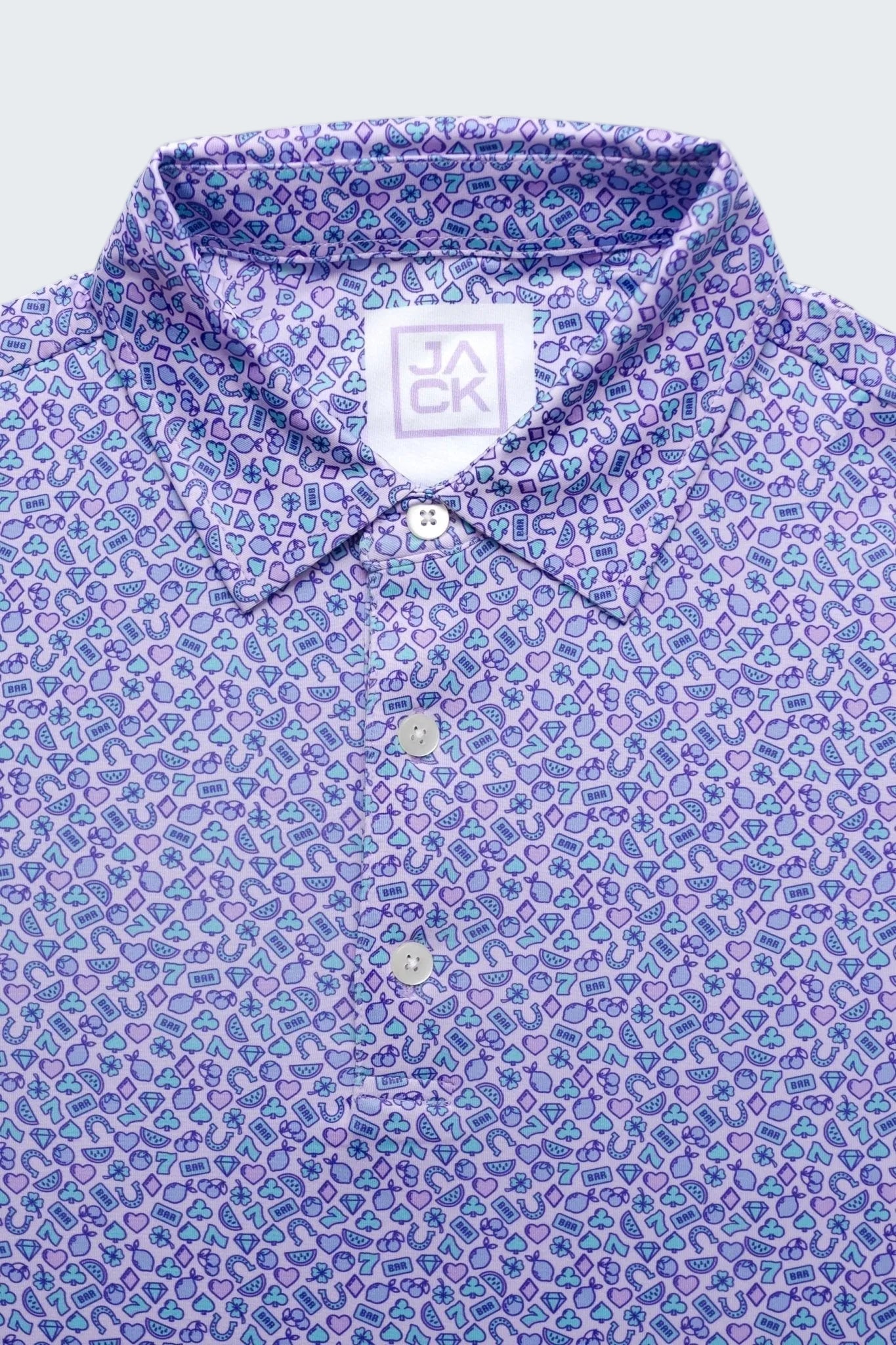 Close-up of a patterned shirt with a brand label on a white background