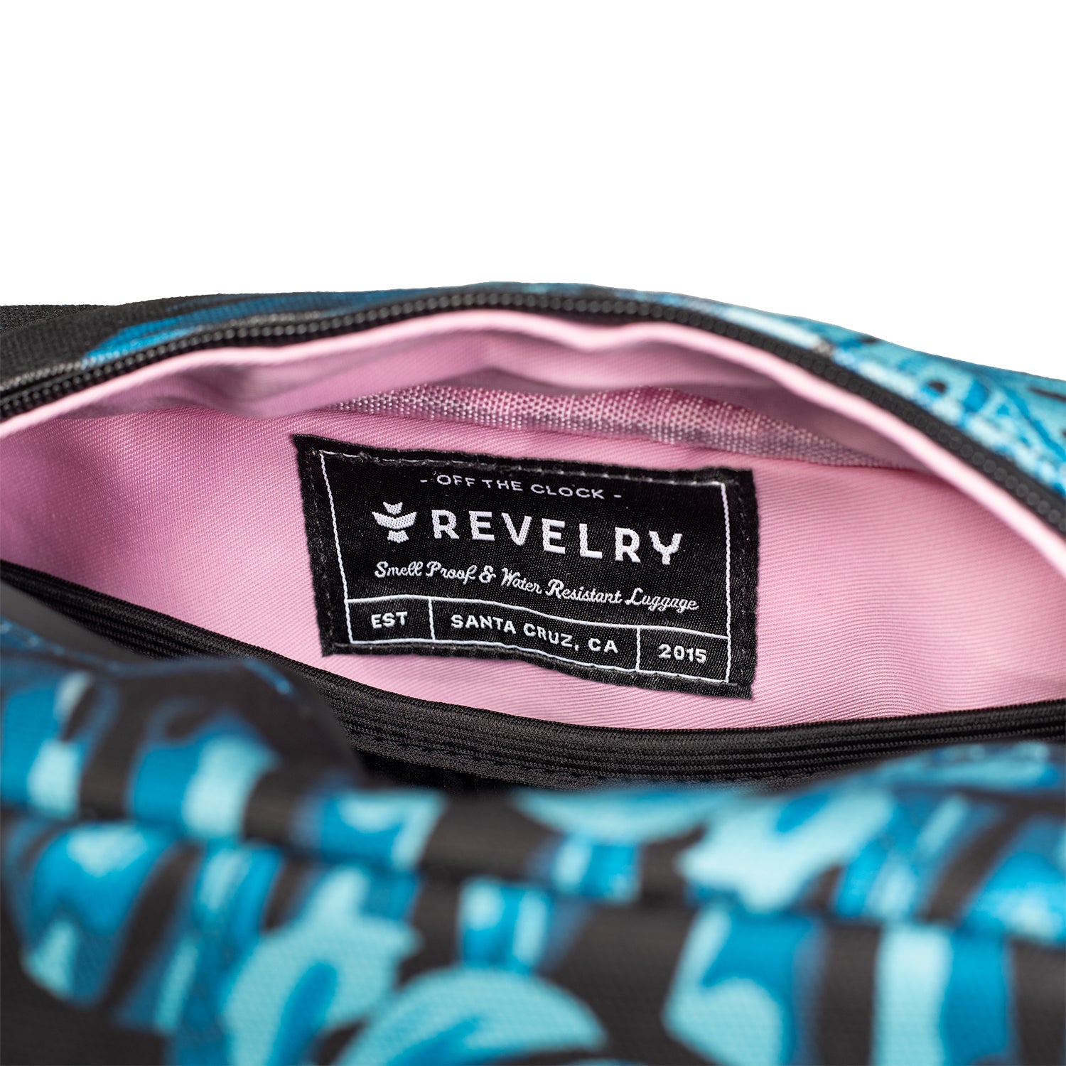 Revelry luggage tag inside a bag with blue and black pattern