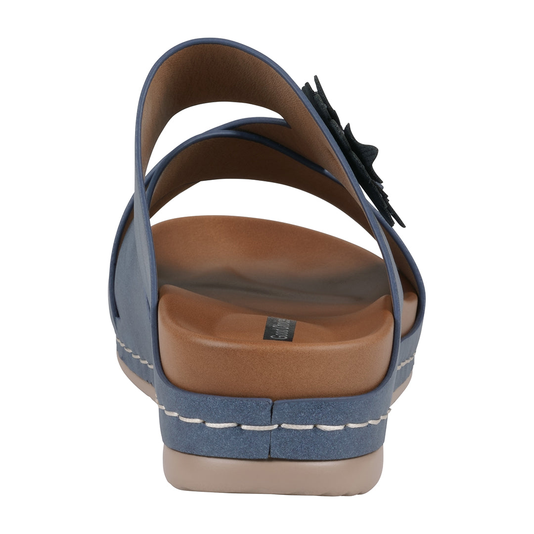 Blue sandal with brown sole on a white background