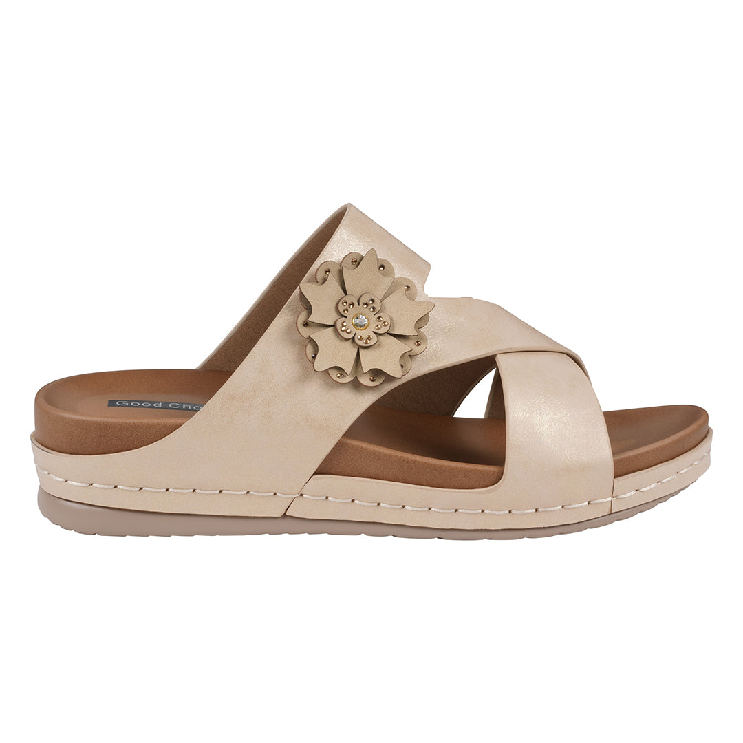 Beige sandal with a floral design on a white background