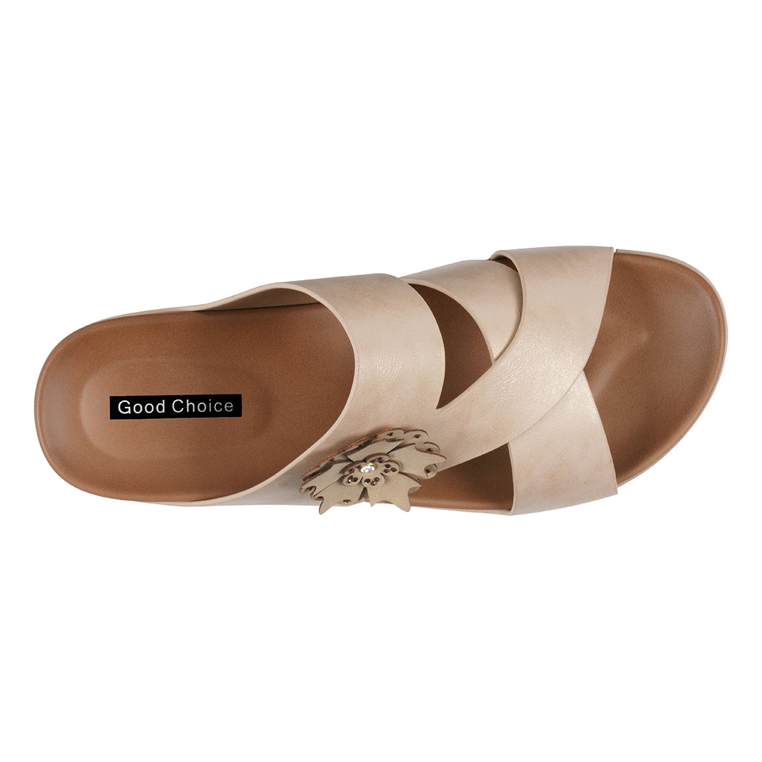 Beige sandal with a decorative element on a white background