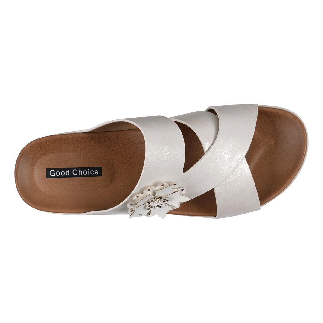 White sandal with brown sole on a white background
