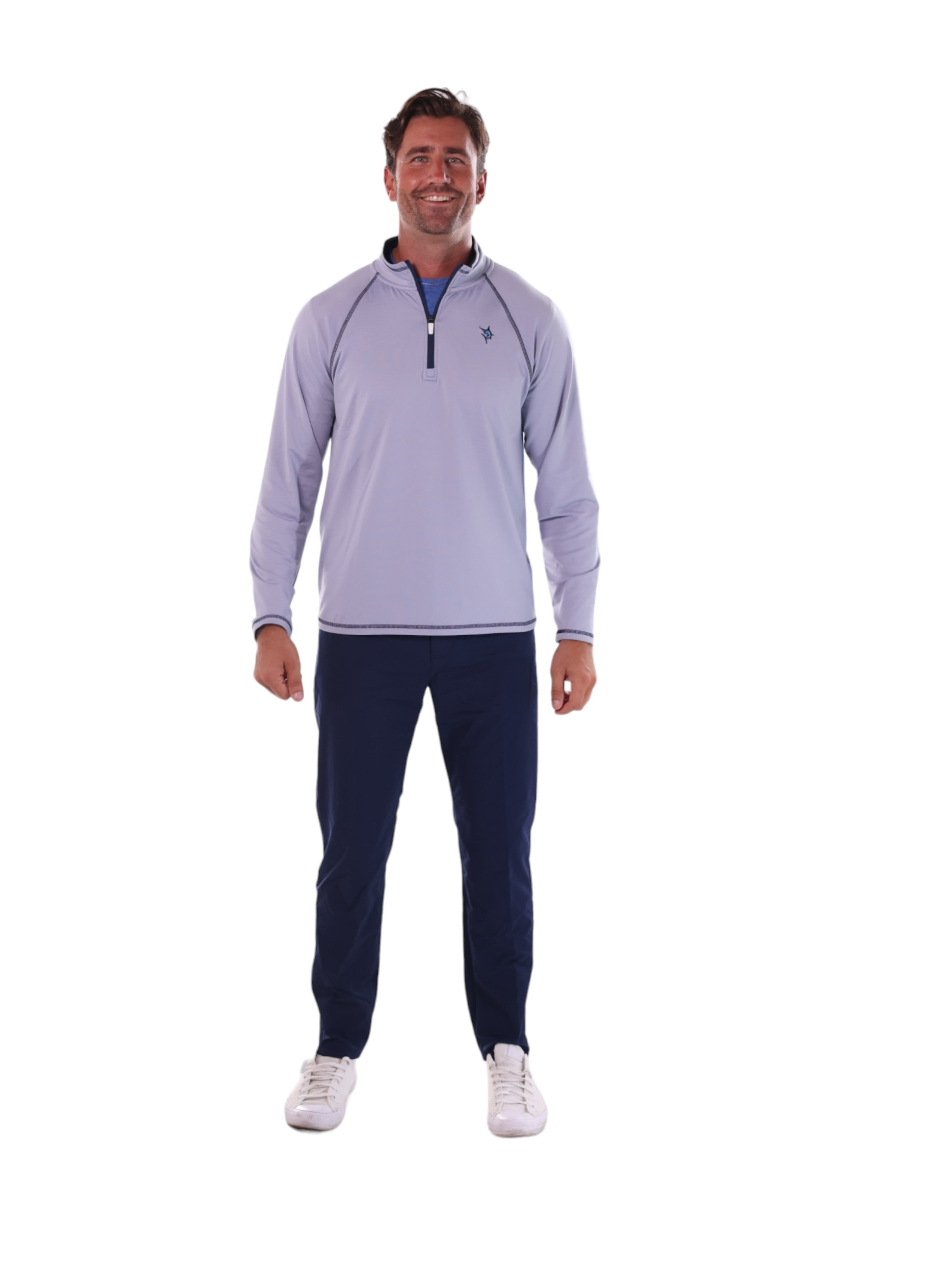 Man wearing a light purple long-sleeve shirt and navy pants on a white background