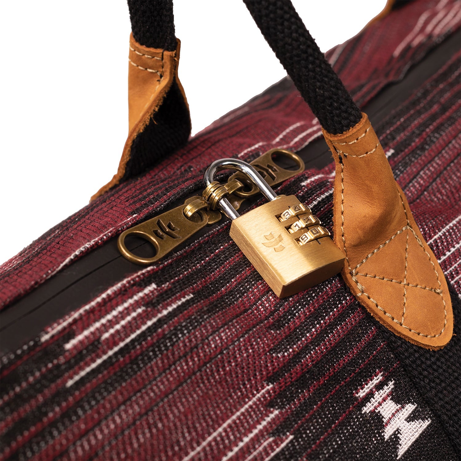 Close-up of a suitcase with a gold combination lock on a white background