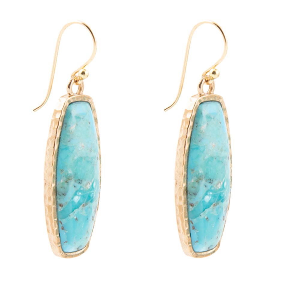 Turquoise stone earrings with gold frames on a white background