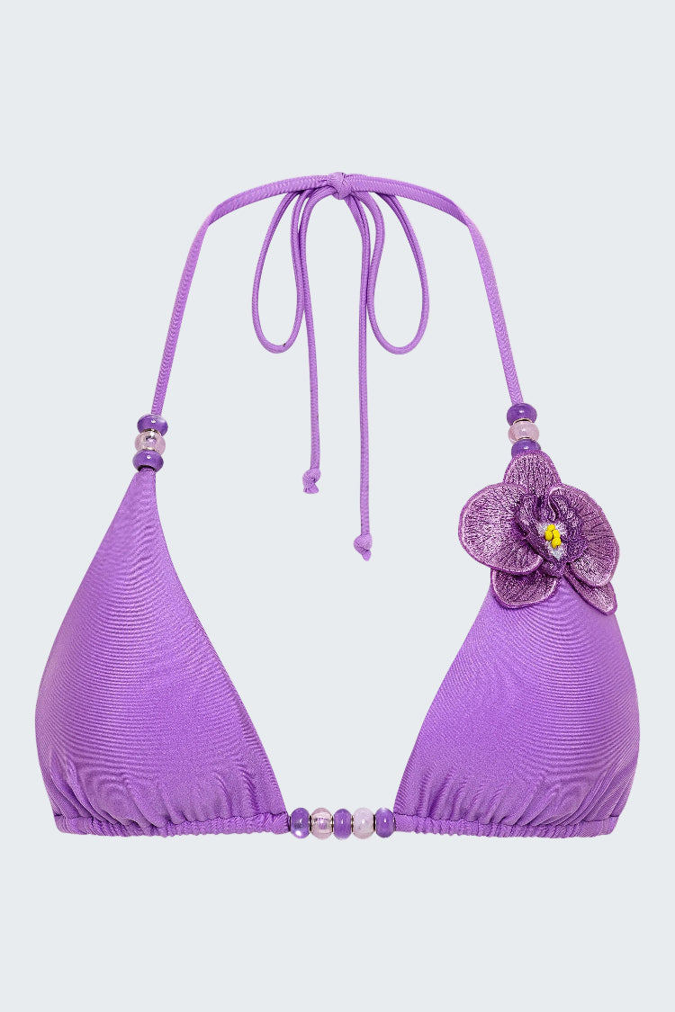 Purple bikini top with floral design on a white background