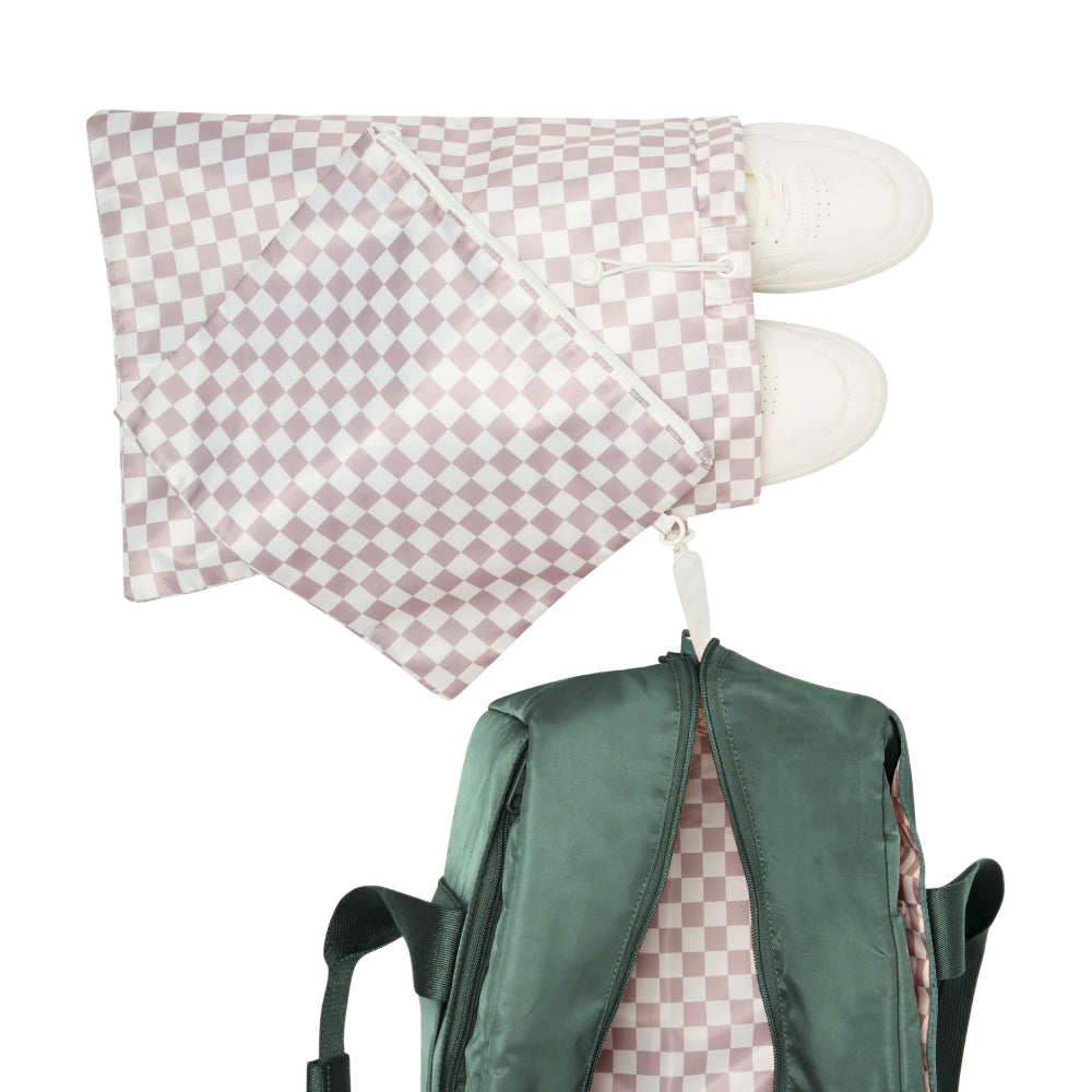 Green backpack with pink checkered pouch on a white background