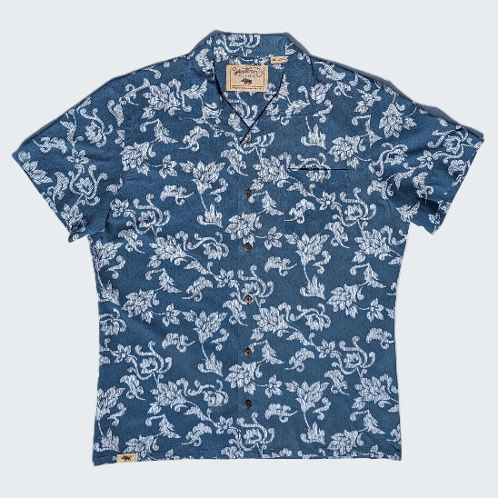 Blue floral patterned shirt on a white background