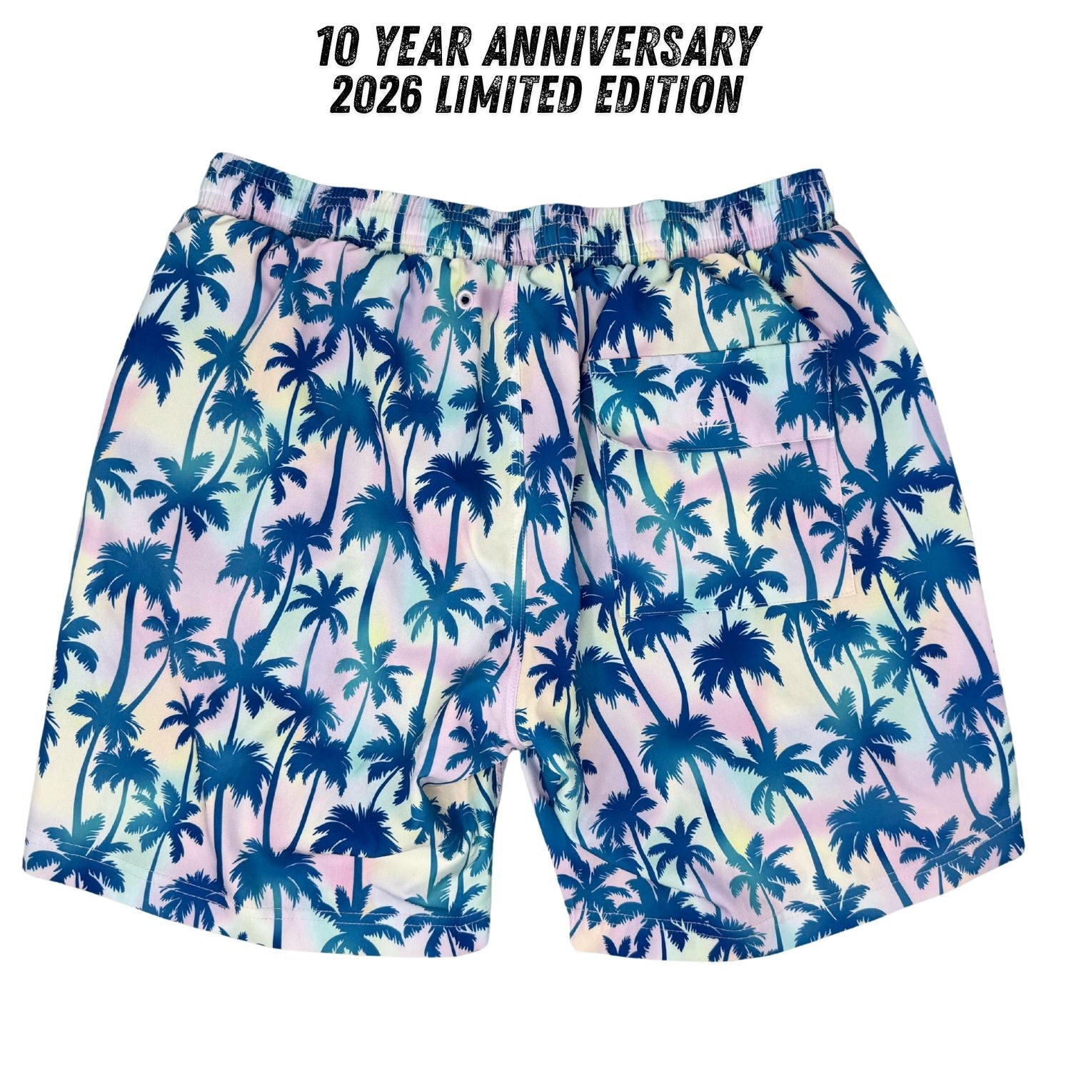 Palm tree patterned shorts with 10 Year Anniversary 2026 Limited Edition text on a white background