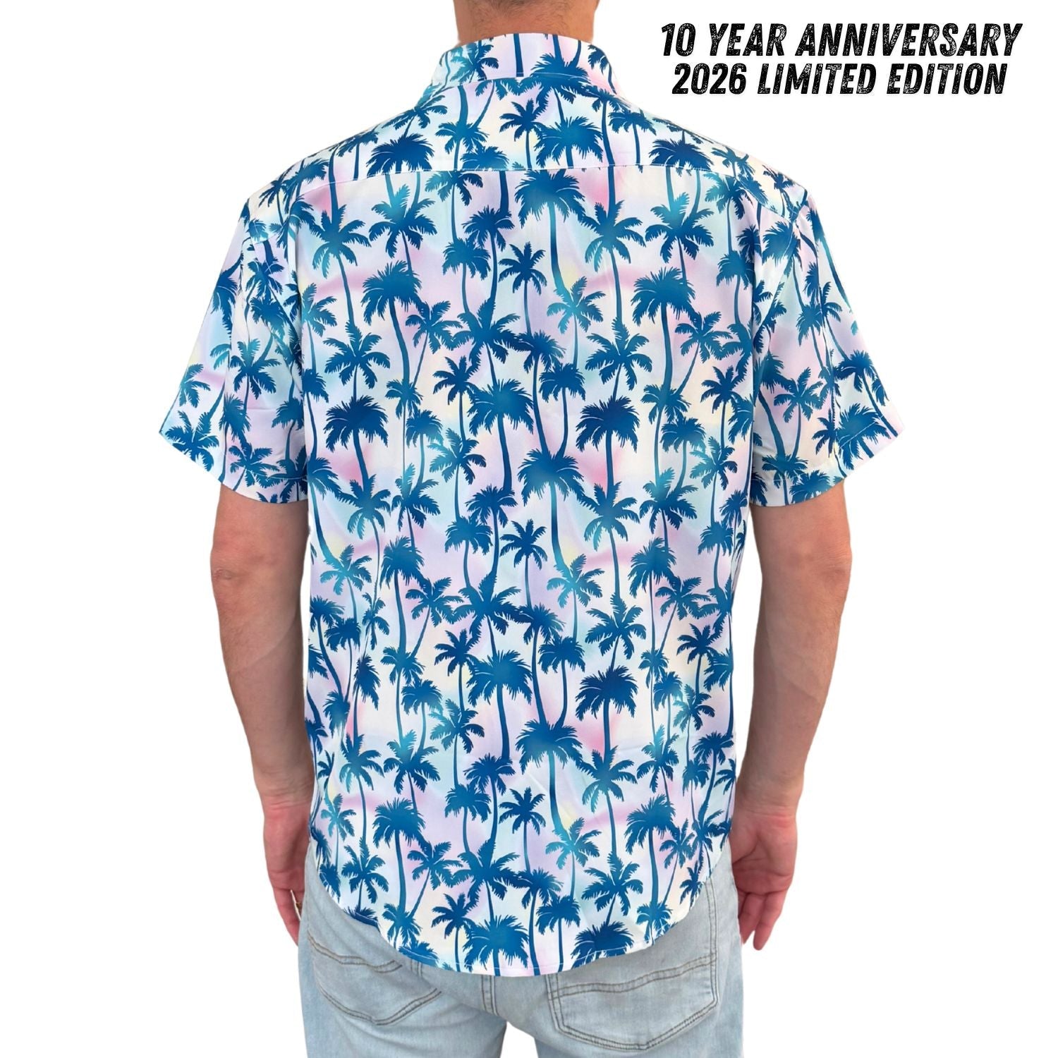 Person wearing a shirt with blue palm tree pattern, labeled '10 Year Anniversary 2026 Limited Edition'.