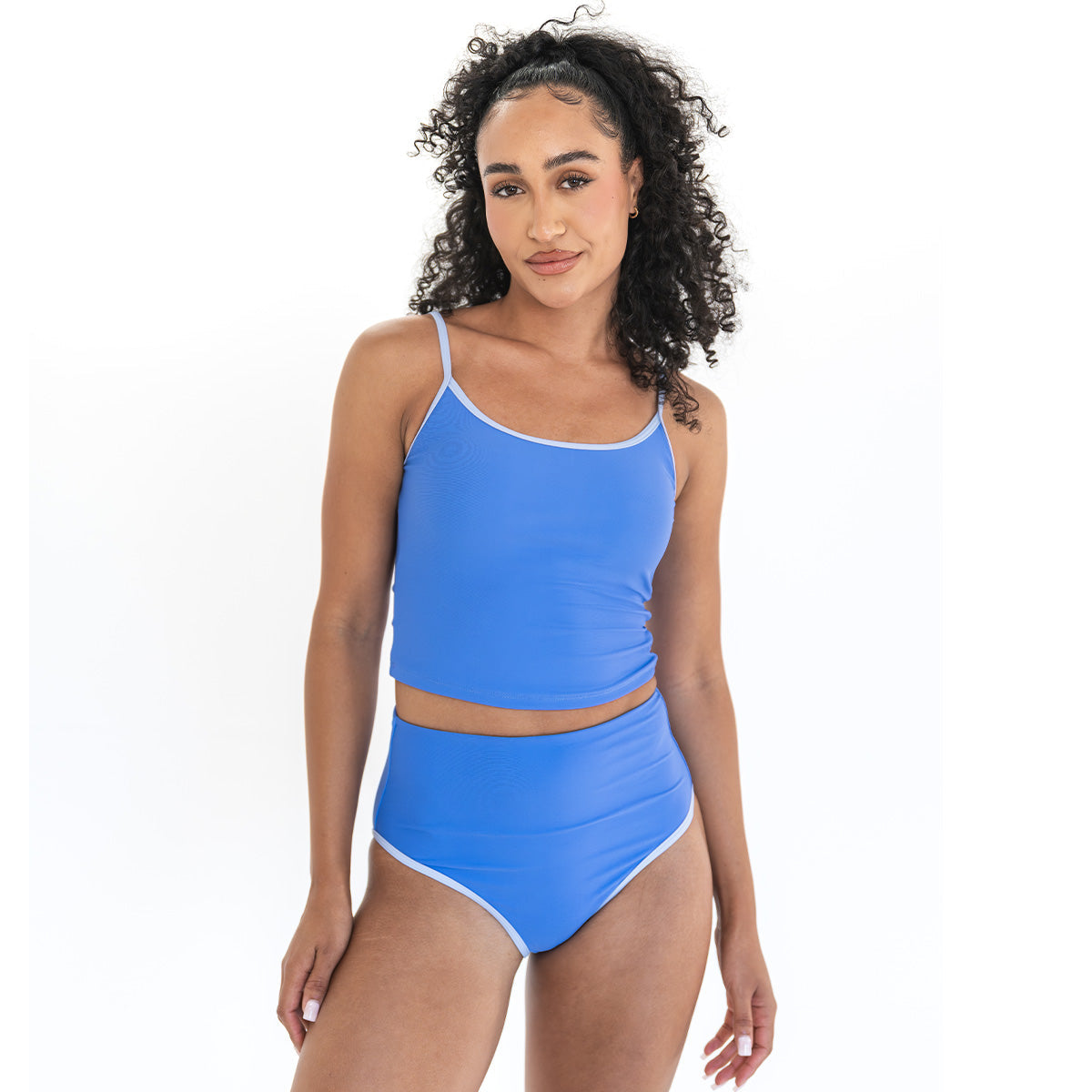 Woman wearing a blue swimsuit on a white background