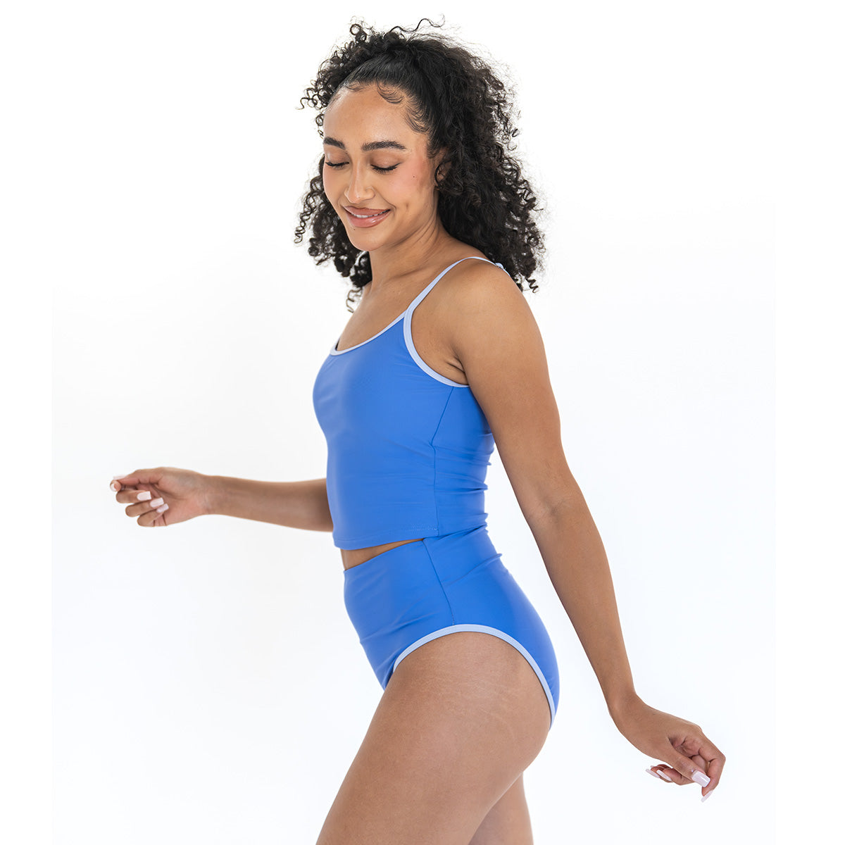 Woman wearing a blue swimsuit on a white background
