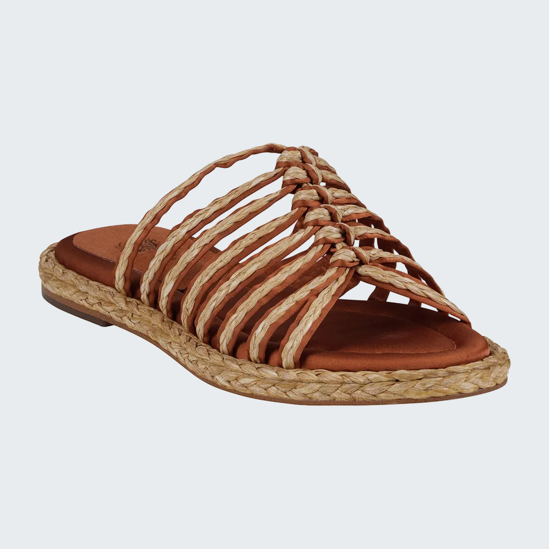 Brown sandal with woven straps on a white background