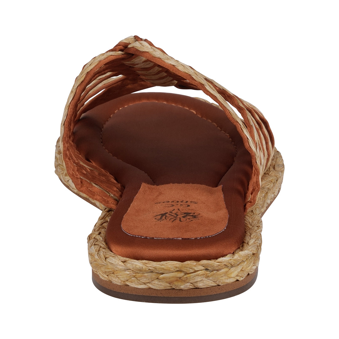 Brown sandal with woven design on a white background