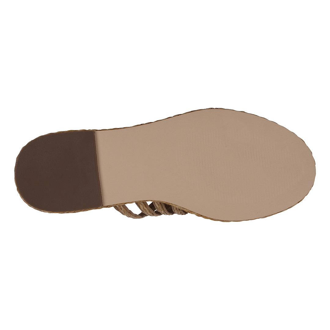 Close-up of a sandal sole with brown insole on a white background