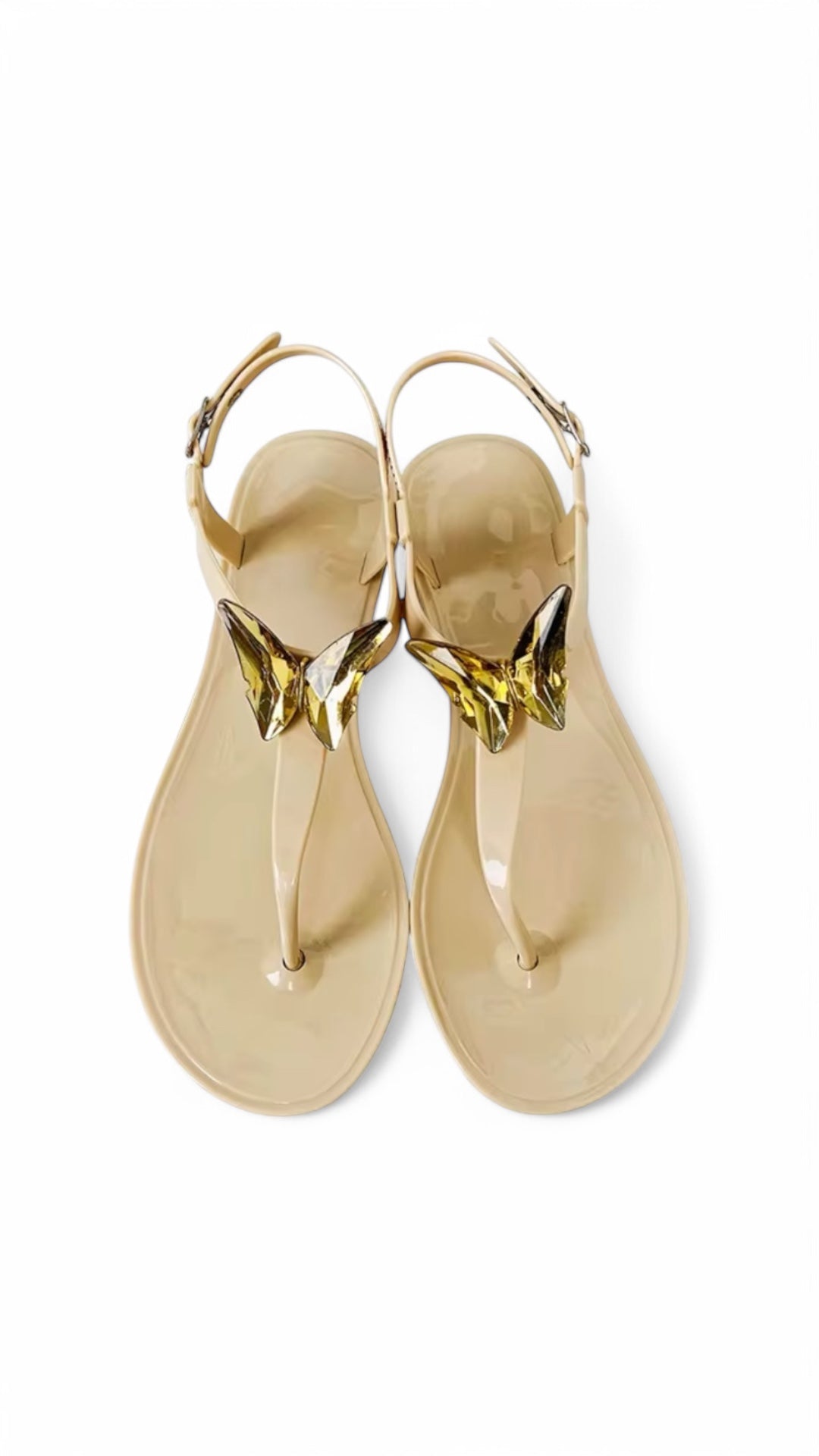 Gold sandals with a white background